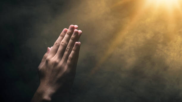 Sunlight breaking through clouds, symbolizing faith