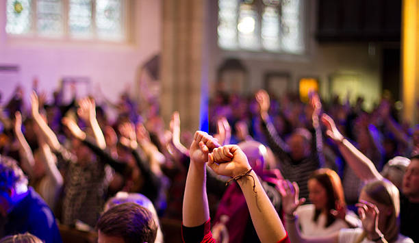 Hands folded together in quiet prayer